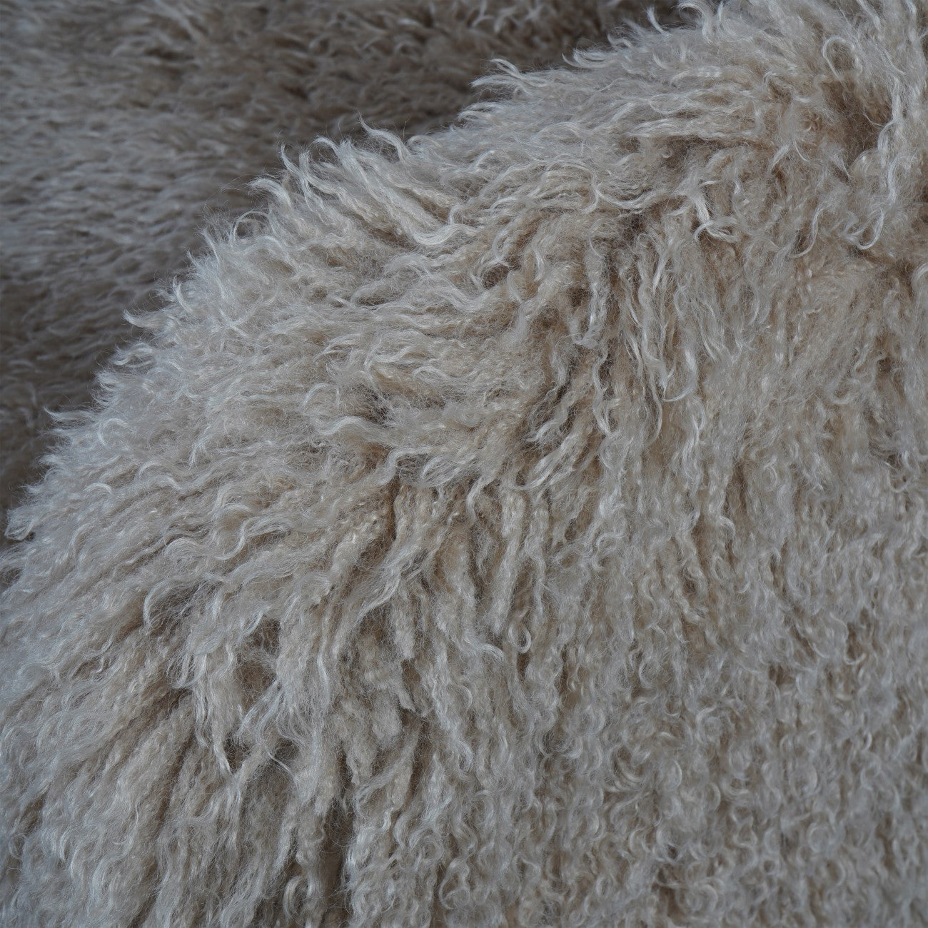 Close-up of fluffy beige fabric texture