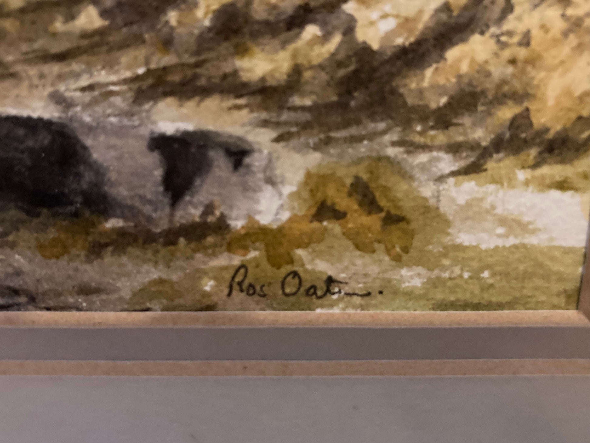 Close-up of a watercolor painting with a signature at the bottom right corner.