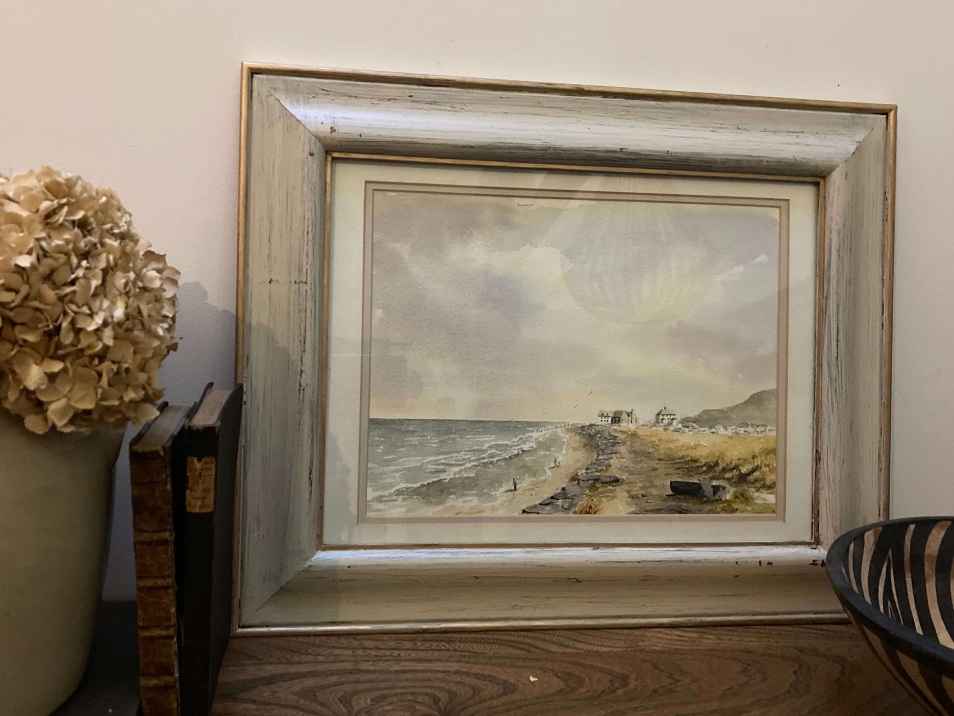 Framed watercolour painting of a coastal scene