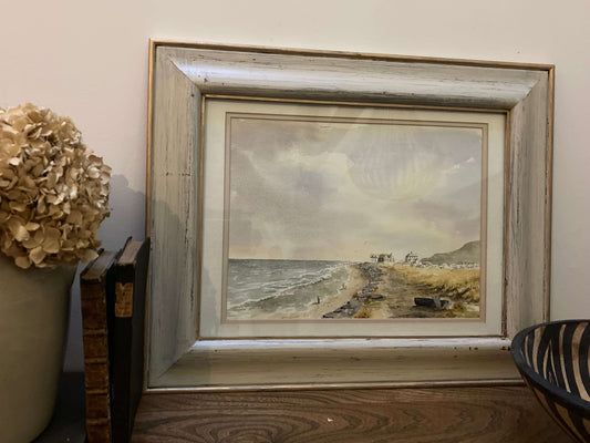 Framed watercolour painting of a coastal scene