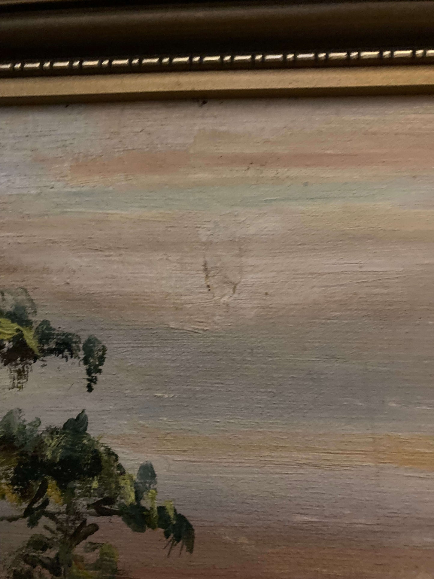 Close-up of a textured surface with horizontal lines and greenery at the bottom