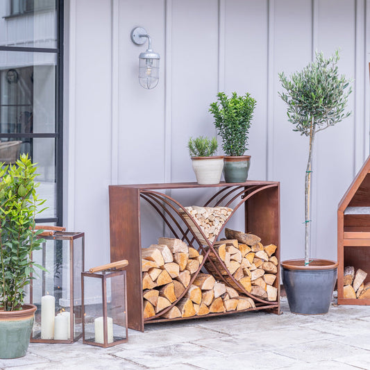 Outdoor Sculptural Log Storage in Rust Finish