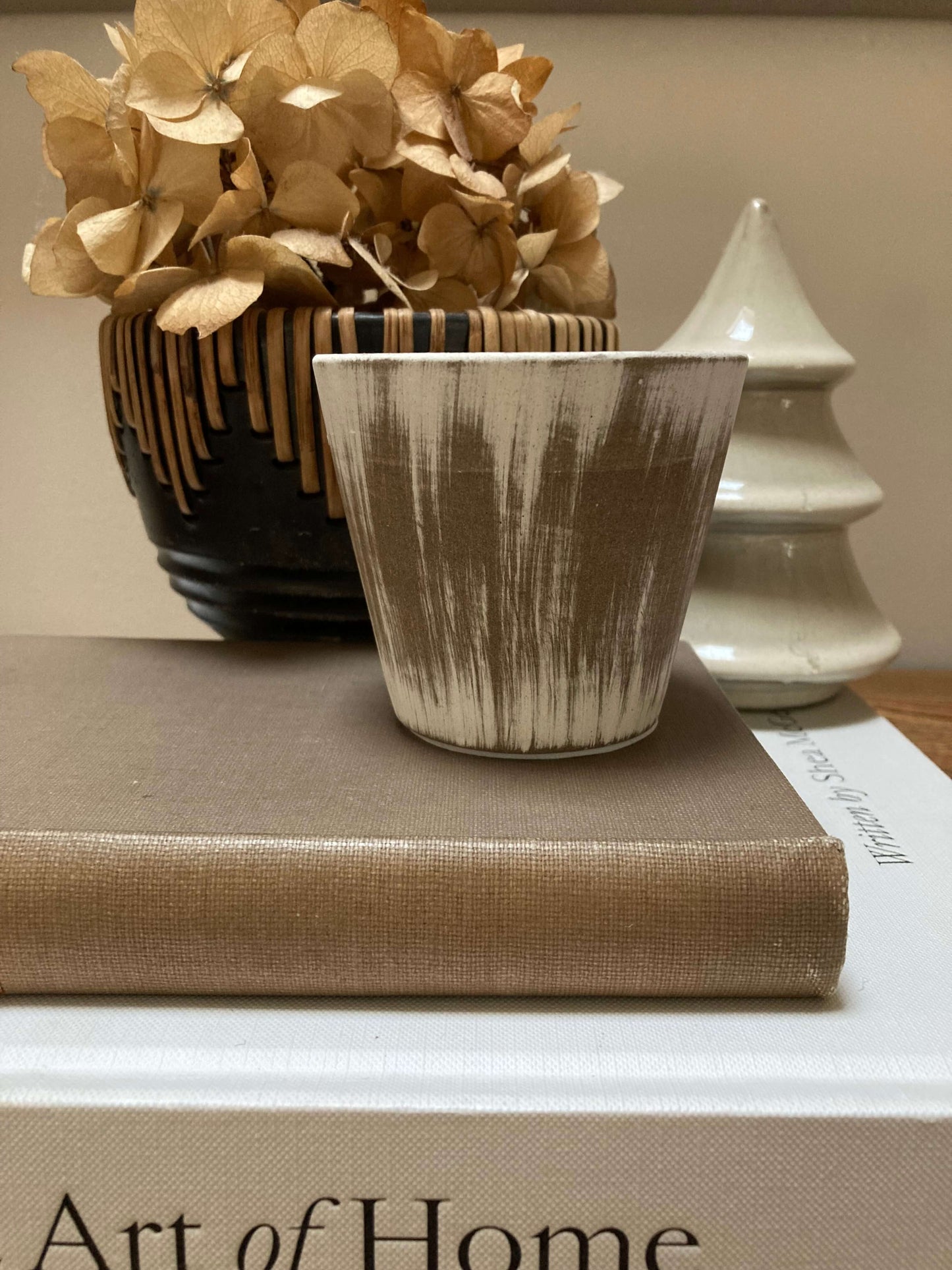 small neutral ceramic candle pot