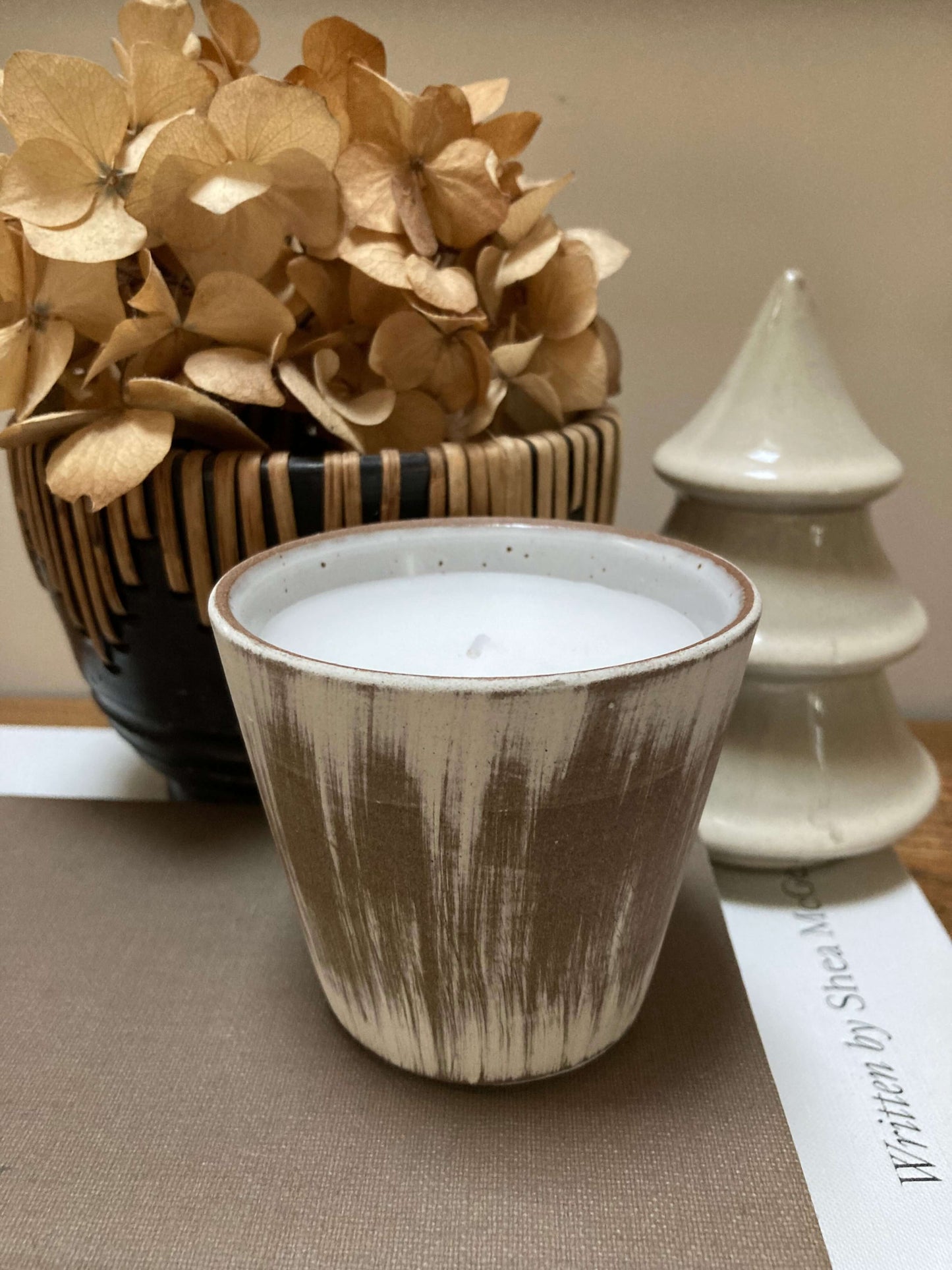 small neutral ceramic candle pot