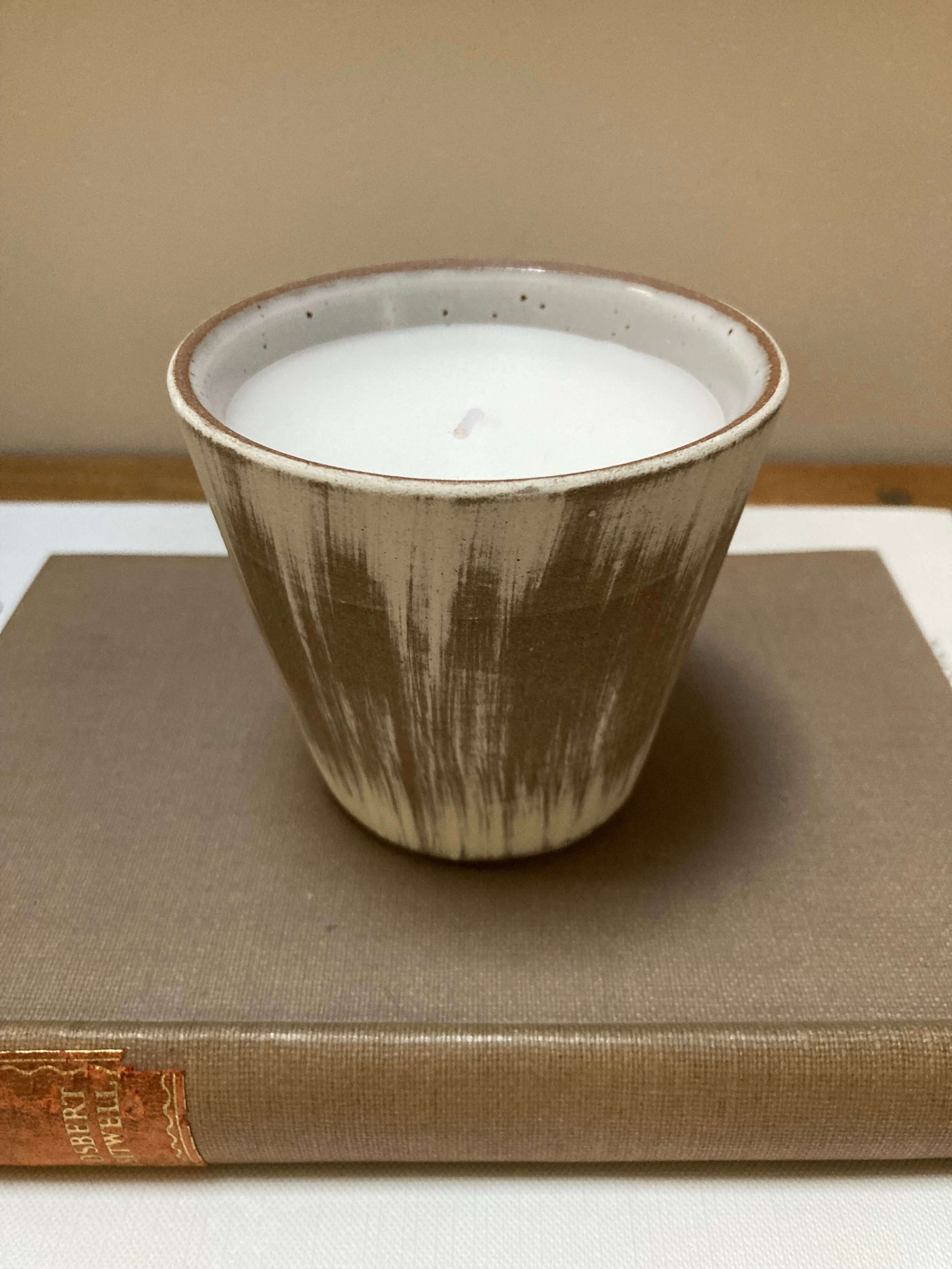 small neutral ceramic candle pot